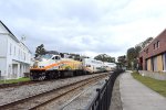 A northbound early afternoon Sunrail Train enroute from Poinciana to DeLand, rounds the bend in Downtown Winter Park just before arriving at the WPK Depot-MP32PH-Q # 110 is doing the honors 